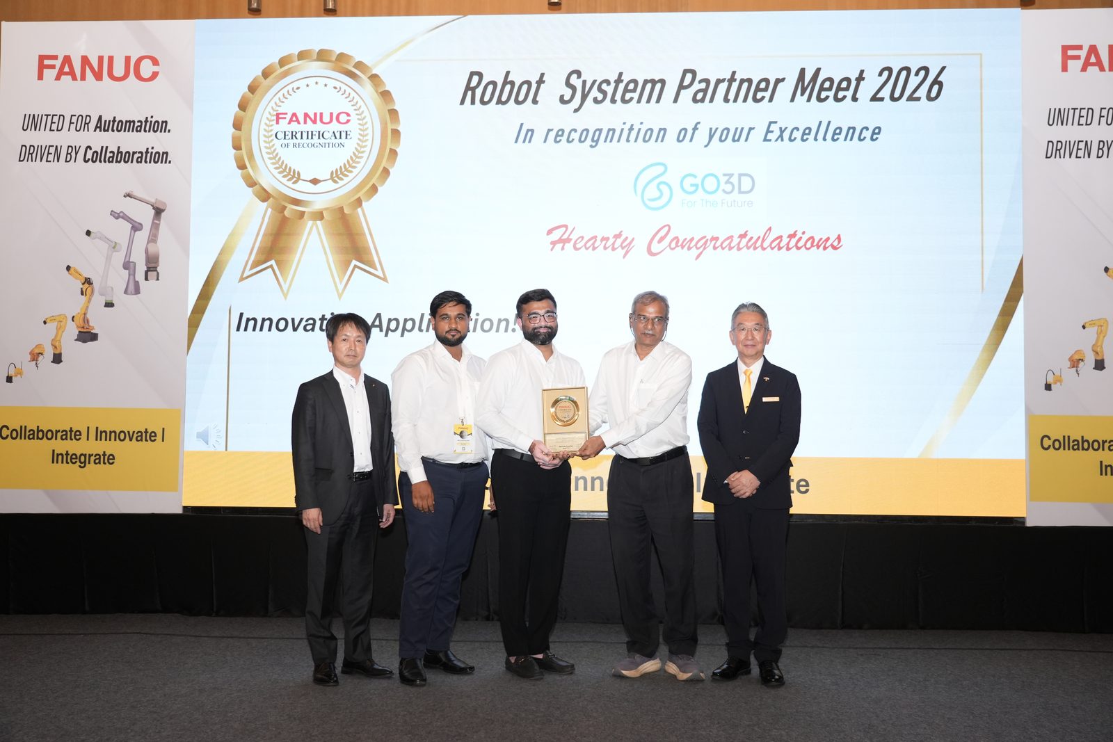 GO3D receiving the FANUC Innovative Application award on stage at the FANUC Robot System Partner Meet 2026 in Bengaluru